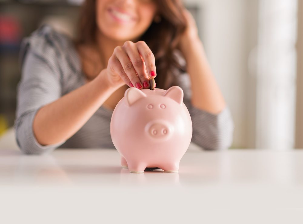 Woman-Using-Piggy-Bank