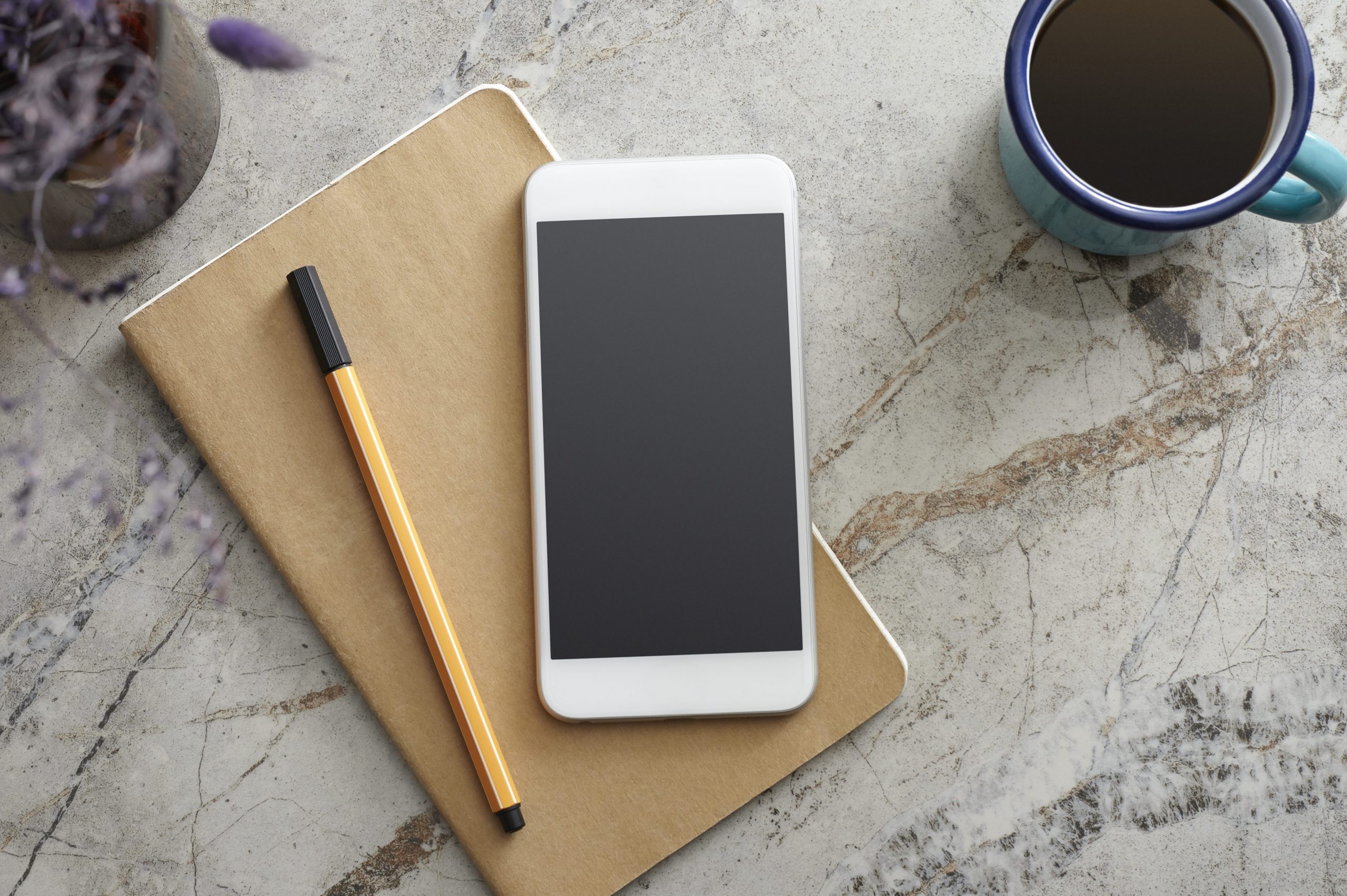 Smart Phone and Notebook on the Desk