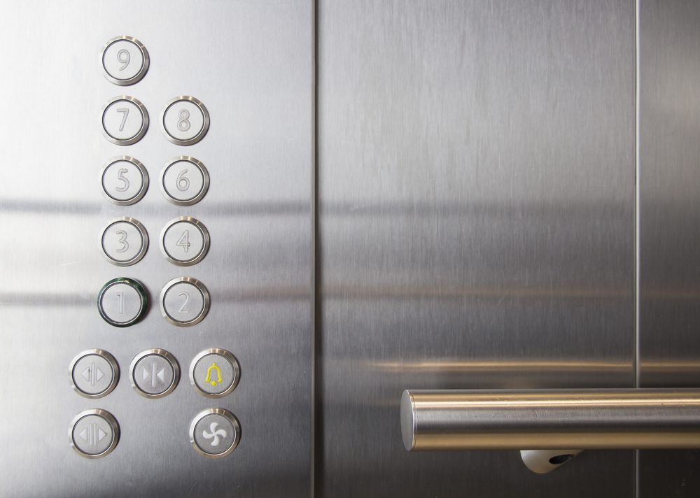 In the elevator floor buttons