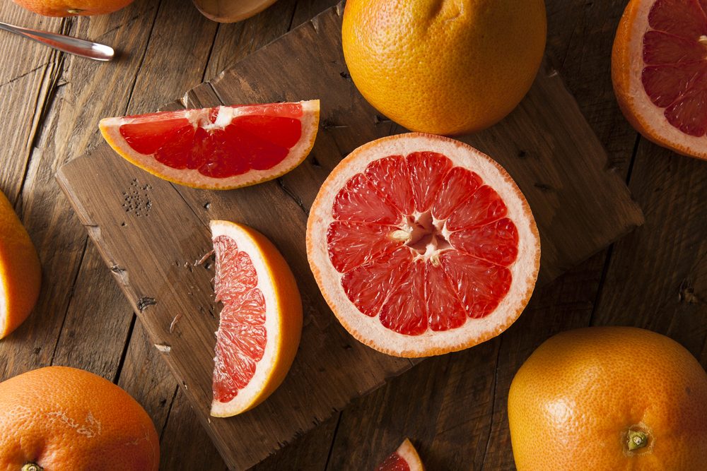 Healthy Organic Red Ruby Grapefruit on a Background