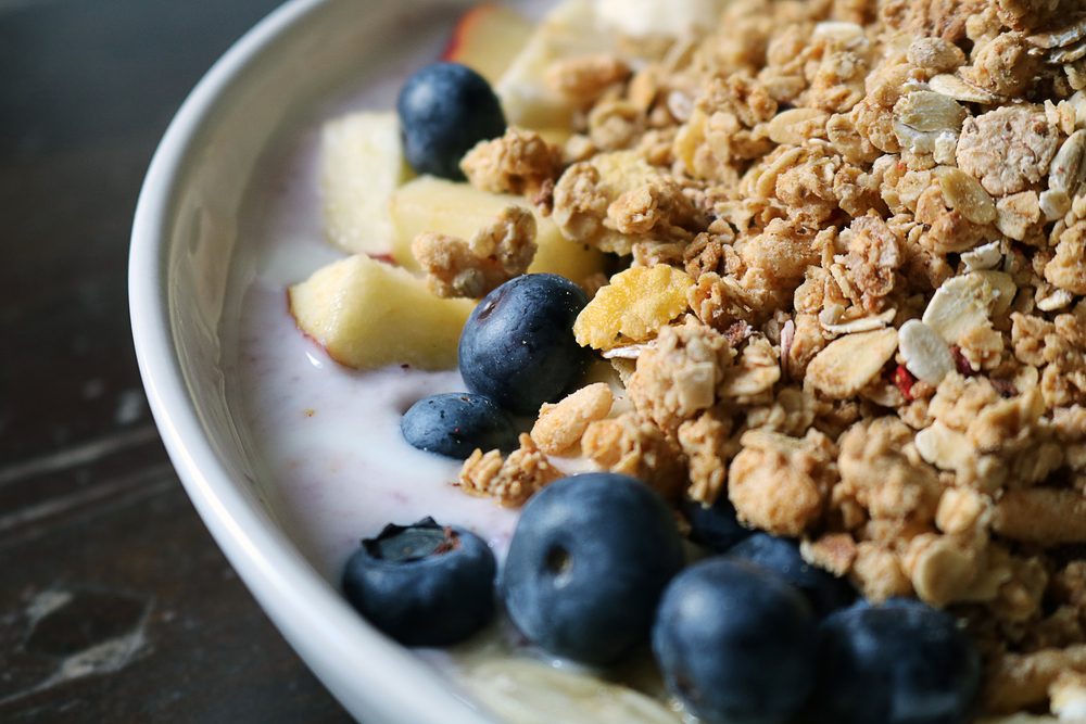 Detail of a breakfast bowl of cereal with fruits and yogurt (brighter shadows with color filter)